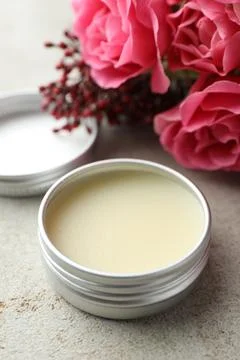 Natural solid perfume and flowers on light table, closeup 스톡 사진