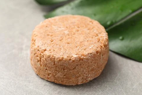 Natural solid shampoo bar on grey table, closeup Stock Photos