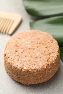 Natural solid shampoo bar on grey table, closeup 写真素材