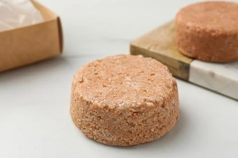 Natural solid shampoo bars on light table 스톡 사진