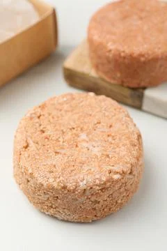 Natural solid shampoo bars on light table Stock Photos