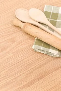Natural solid wood kitchen tools and table napkin on a wooden tabletop 스톡 사진