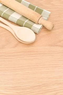 Natural solid wood kitchen tools and table napkin on a wooden tabletop Stock Photos