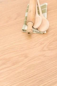 Natural solid wood kitchen tools and table napkin on a wooden tabletop Stock Photos