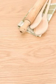 Natural solid wood kitchen tools and table napkin on a wooden tabletop Stock Photos