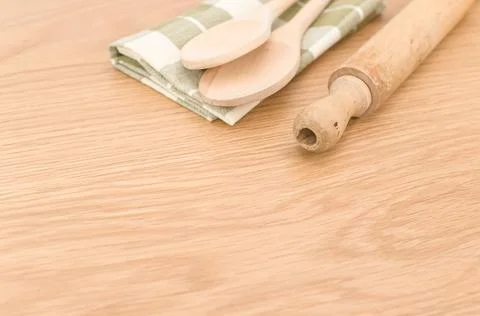 Natural solid wood kitchen tools and table napkin on a wooden tabletop Stock Photos