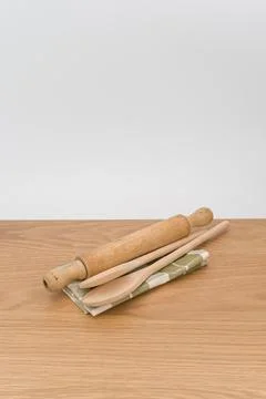 Natural solid wood kitchen tools and table napkin on a wooden tabletop Stock Photos