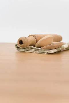 Natural solid wood kitchen tools and table napkin on a wooden tabletop Stock Photos