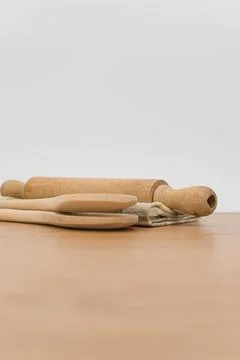 Natural solid wood kitchen tools and table napkin on a wooden tabletop Stock Photos