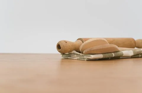 Natural solid wood kitchen tools and table napkin on a wooden tabletop Stock Photos