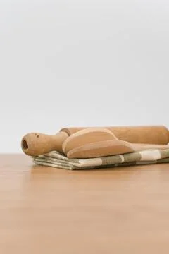 Natural solid wood kitchen tools and table napkin on a wooden tabletop Stock Photos