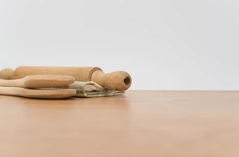 Natural solid wood kitchen tools and table napkin on a wooden tabletop Stock Photos
