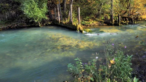 The natural source of the Red Key in Bashkiria is blue. At sunset in autumn Stock Footage 132792660