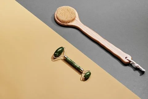 Natural Spa background. Minimal composition with jade massage roller and bamboo Stock Photos