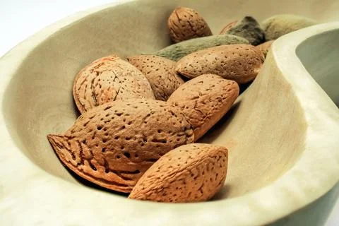 Natural split almonds in the foreground Stock Photos