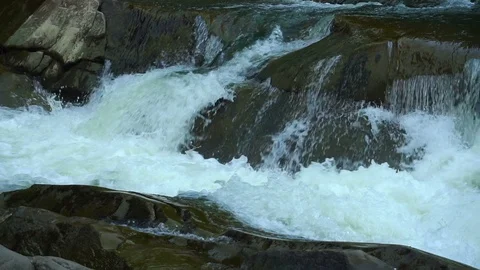 Natural spring drops fall in slow motion. Water flows dribbles and fall in drops Stock Footage 95648566