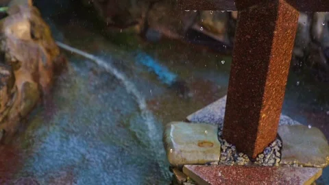 Natural spring drops fall in slow motion. Water flows dribbles and fall in drops Stock Footage 95715694