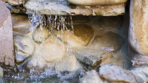 Natural spring drops fall in slow motion. Water flows dribbles and fall in drops Stock Footage 95718490