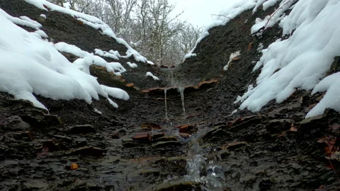 Natural spring that flows down the mountain from the very top. Stock Footage 151955442