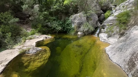 Natural spring in the mountain with crystal clear water Video stock 243034153