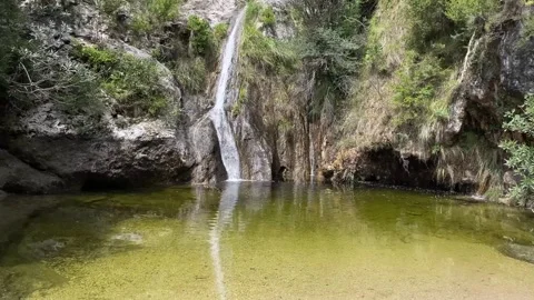 Natural spring in the mountain with crystal clear water Video stock 243034248