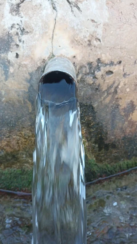 Natural Spring Water Flowing From Pipe 動画素材 335081782