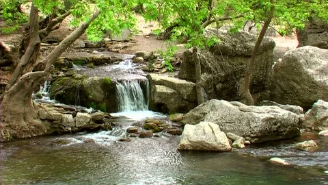 Natural spring waters flowing from the mountains Stock Footage 104387902