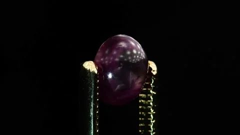 Natural star ruby gemstone on the turning table Stock Footage 153021610