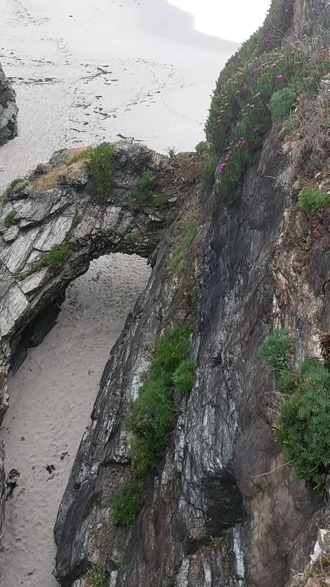 Natural Stone Arch and Cliff Rock Formations at Os Castros Beach in Ribadeo Vídeo Stock 342878806