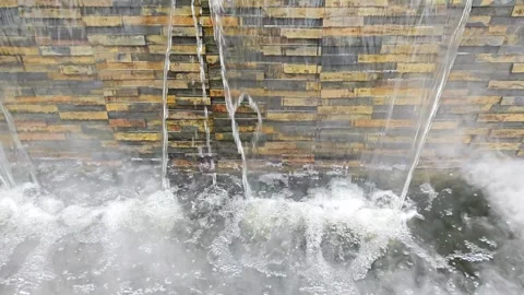 Natural Stone Cladding Waterfall Wall Feature with Dense Mist. 動画素材 340048097