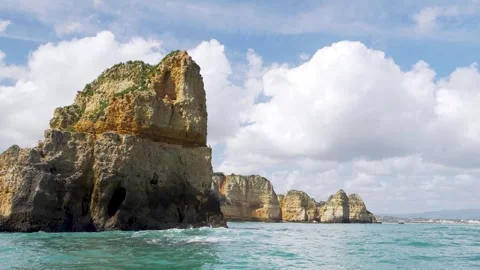 Natural stone formation in the ocean with cliffs in Portugal Stock Footage 273674554