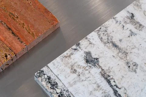 Natural stone samples and brushed metal surface Stock Photos