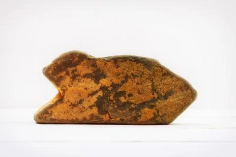Natural stone shaped arrow pointer on white background mock up for text, phra Stock Photos