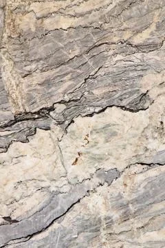 Natural stone surface showcasing unique patterns and textures in neutral tone Stock Photos
