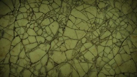 A natural stone texture featuring a network of cracks with olive green and .. Stock-Illustration