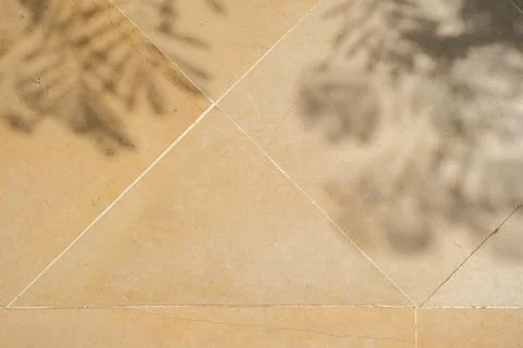 Natural Stone Tile Background with Leaf Shadow Stock Photos