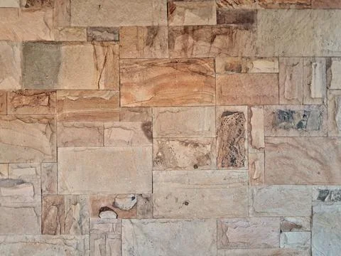 Natural stone wall cladding texture background Stock Photos