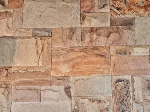 Natural stone wall cladding texture background Stock Photos