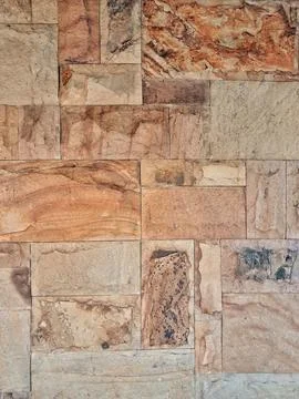 Natural stone wall cladding texture background Stock Photos