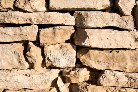 Natural stone wall close-up Stock Photos