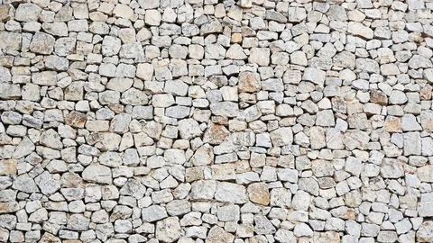 Natural stone wall, cottage, rustic construction Stock Footage 83311189