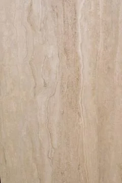 Natural stone wall featuring soft beige tones and subtle veining in a modern 스톡 사진
