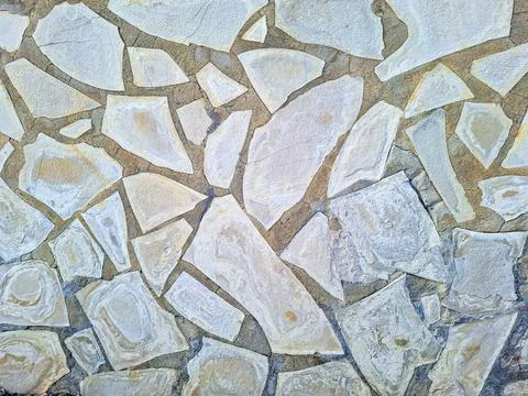 Natural stone wall texture with final plastering reveals unique patterns an.. Fotos Stock