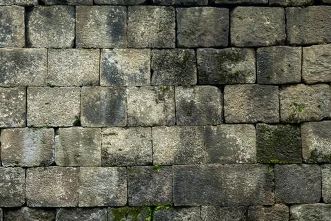 Natural Stone Wall with Textured Pattern Background, Featuring a Rough Surf.. Foto stock