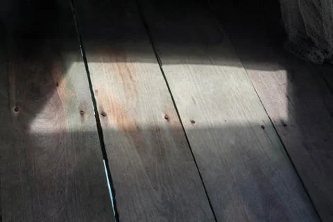 Natural Sunlight and Shadow on Rustic Wooden Floor Stock Photos