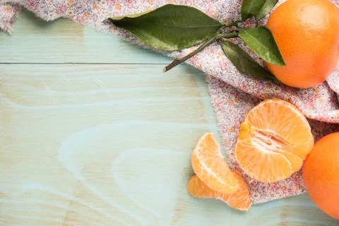 Natural sweet clementines on rustic table from above Stock Photos