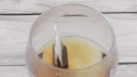 Natural tea bag close-up. Brew the tea bag in boiling water. Video stock 184471833