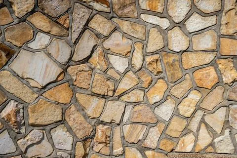 Natural texture background stone wall sunny weather outdoor Stock Photos