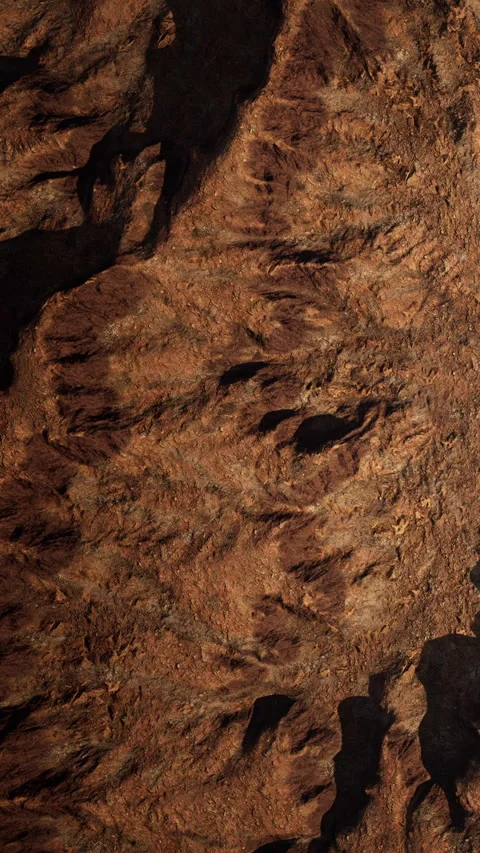 Natural texture of brown earth and rocks in a rugged area Stock Footage 345010146