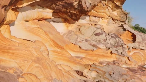 Natural texture of wave pattern on warm orange sandstone geological layer Video stock 340749753